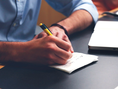 Calculating on paper on desk